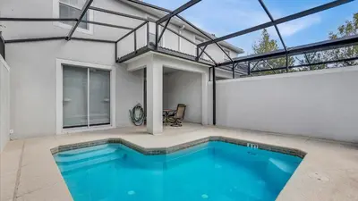 an indoor swimming pool in a house with a building at GAS3070 in Kissimmee