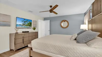 a bedroom with a bed and a ceiling fan at GAS3070 in Kissimmee