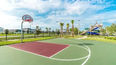 a basketball court with a hoop in a park at Storey Lake Resort Vacation Townhome - includes resort clubhouse 0753 in Kissimmee