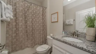 a bathroom with a toilet and a sink and a shower at KCC 4797 in Kissimmee