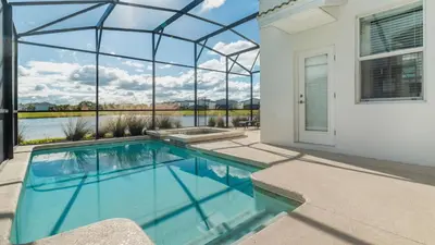 a swimming pool in a house with a large window at KCC 4797 in Kissimmee