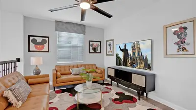 a living room with a couch and a tv at PLW4277 in Kissimmee
