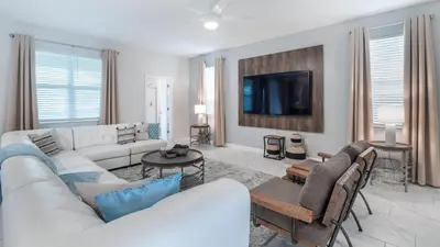 a living room with a couch and a tv at NRL4543 in Kissimmee