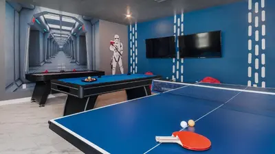 two pool tables in a room with blue walls at NRL4543 in Kissimmee
