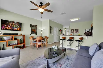 a living room with a couch and a table at Windsor Hills 3 Bedroom Private Pool Townhome 0858 in Orlando
