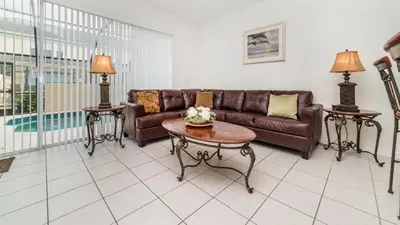 a living room with a couch and a table at Windsor Hills 3 Bedroom Private Pool Townhome 0865 in Orlando