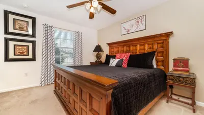 a bedroom with a bed and a ceiling fan at Windsor Hills Resort 6 Bedroom Home Incredible Game Room 0852 in Orlando