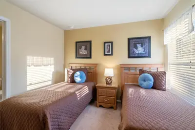 a bedroom with two beds and two pillows at Windsor Hills Resort 5 Bedroom Private Pool Home 0869 in Orlando