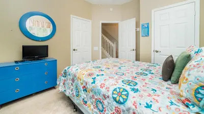a bedroom with a bed and a blue dresser at Windsor Palms Resort 3 Bedroom Pool Townhome 0868 in Kissimmee