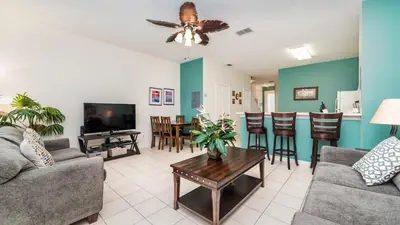 a living room with a couch and a table at Windsor Palms Resort 3 Bedroom Pool Townhome 0868 in Kissimmee