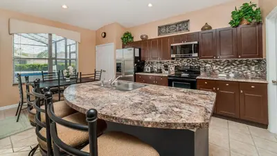 a kitchen with a large island with a counter top at Windsor Palms Resort 4 Bedroom Home With Game Room 0843 in Kissimmee