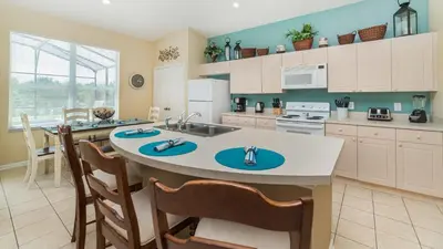 a kitchen with a large island with a sink in it at Windsor Palms Resort 4 Bedroom with Game Room 0878 in Kissimmee