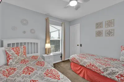 a bedroom with two beds and a window at Windsor Palms Resort 4 Bedroom with Game Room 0882 in Kissimmee