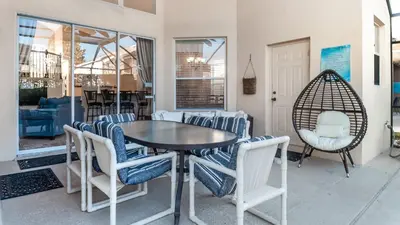 a dining room with a table and chairs at Windsor Palms Resort 6 Bedroom with Pool Spa 0877 in Kissimmee