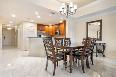 a dining room and kitchen with a table and chairs at AQ0401 Villas North Charm in Orlando