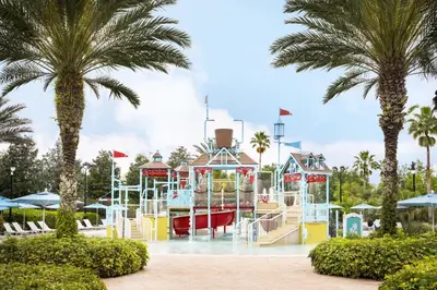 a water park with a playground with palm trees at AQ0401 Villas North Charm in Orlando