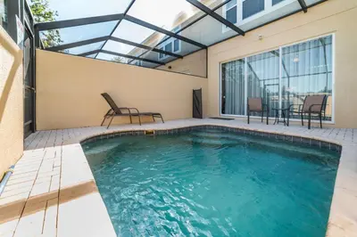 a swimming pool in a house with a patio at MSW2505 in Orlando