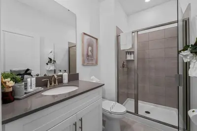 a bathroom with a sink and a toilet and a shower at Family Mickey & Star Wars - FREE Heated Pool in Kissimmee