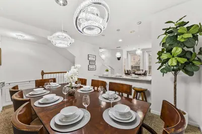 a dining room with a table and chairs at 5014 Tideview Circle 9 in Orlando