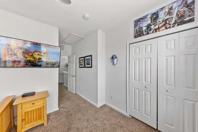 a room with white walls and a large painting on the wall at 5014 Tideview Circle 9 in Orlando