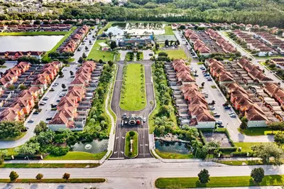 an aerial view of a parking lot with houses at Lakefront 4 Bed private Oasis Location in Kissimmee