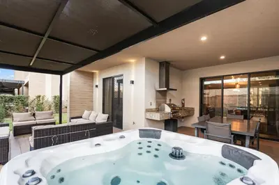 a large room with a bath tub in a living room at 4BD and 4.5BA Amazing Villa with Private Hot Tub (3091) in Orlando