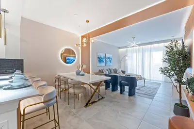 a kitchen and living room with a table and chairs at 304 Storey Lake new 6guests 2 BDRS near lakeClub in Kissimmee