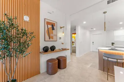 a kitchen with an orange and white wall at 304 Storey Lake new 6guests 2 BDRS near lakeClub in Kissimmee
