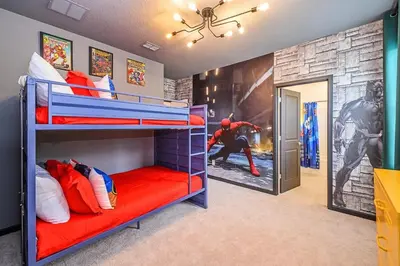 a bedroom with two bunk beds and a wall with a baseball mural at Brand New 12BR Disney Mansion Pool Spa Game Room in Kissimmee