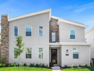 a large white house with a grass yard at Brand New Storey Lake 9BR Villa Summer Kitchen in Kissimmee