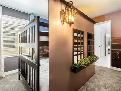 a home hallway with a staircase and a stair case at Brand New Storey Lake 9BR Villa Summer Kitchen in Kissimmee