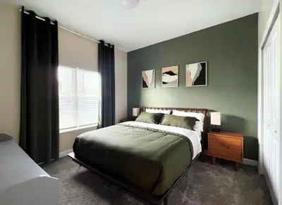 a bedroom with a large bed and a window at 4184PD Weekly Stay 5BR Free Water Park in Kissimmee