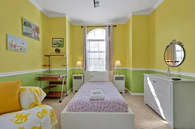 a small room with a bed and a window at 11326 CYPRESS TRAIL DRIVE ORLANDO 3BED in Orlando