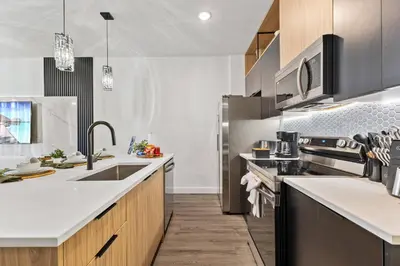 a kitchen with a sink and a stove at 3251 The Hub escape with flex space in Kissimmee