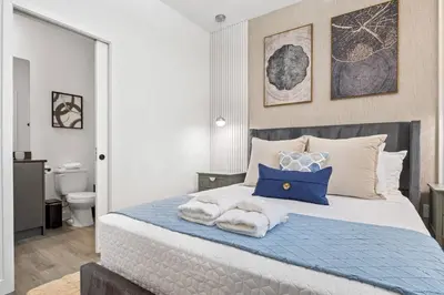 a bedroom with a bed with towels on it at 3251 The Hub escape with flex space in Kissimmee