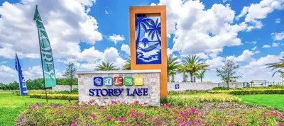 a sign for a showroom in a park with flowers at Dazzling 5BR Villa in Storey Lake with Pool & Spa 1528 in Kissimmee