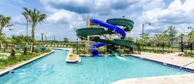 a water slide in a pool at a resort at Dazzling 5BR Villa in Storey Lake with Pool & Spa 1528 in Kissimmee