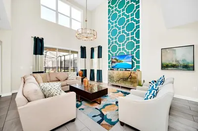a living room with two couches and a table at Dazzling 5BR Villa in Storey Lake with Pool & Spa 1528 in Kissimmee
