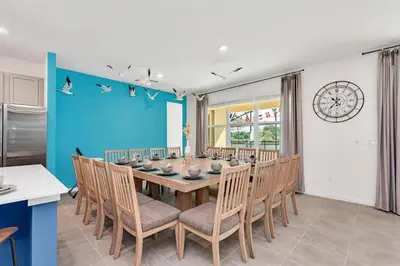 a dining room with a table and chairs at DeepSea World 15 Suites Sleep 30 Oversize Pool Spa in Kissimmee