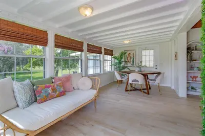 a living room with a white couch and a table at Hope House- Vacation Village 1 Bedroom with Loft in Clermont
