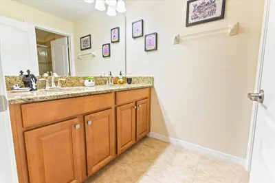 a bathroom with a sink and a mirror at CAL8955 in Kissimmee