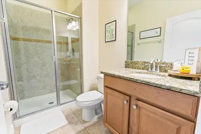 a bathroom with a shower and a toilet and a sink at CAL8955 in Kissimmee
