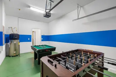 a room with a foosball table and a pool table at CUP8931 in Kissimmee