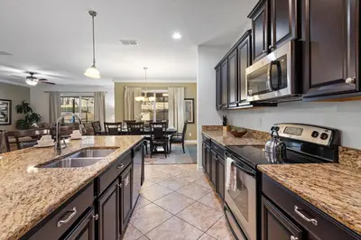 a kitchen with a sink and a counter top at CUP8931 in Kissimmee