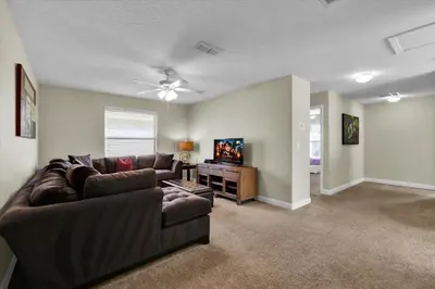 a living room with a couch and a flat screen tv at BPD2920 in Kissimmee