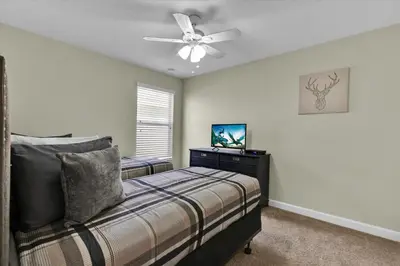 a bedroom with a bed and a ceiling fan at BPD2920 in Kissimmee