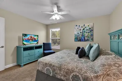 a bedroom with a bed and a ceiling fan at BPD2920 in Kissimmee
