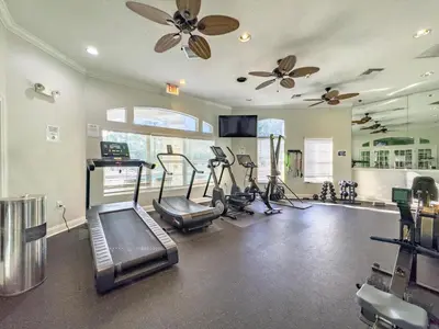 a gym with treadmills and cardio equipment in a room at CCL8538 in Kissimmee