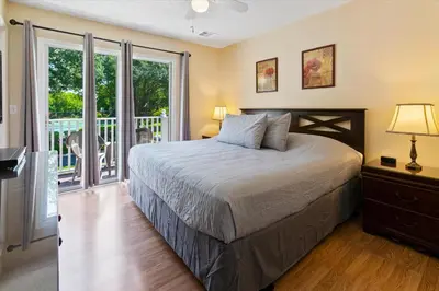 a bedroom with a bed and a balcony at CCL8569 in Kissimmee