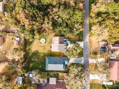 an overhead view of a yard with a house at Full House HotTub Mins to UCF in Bithlo